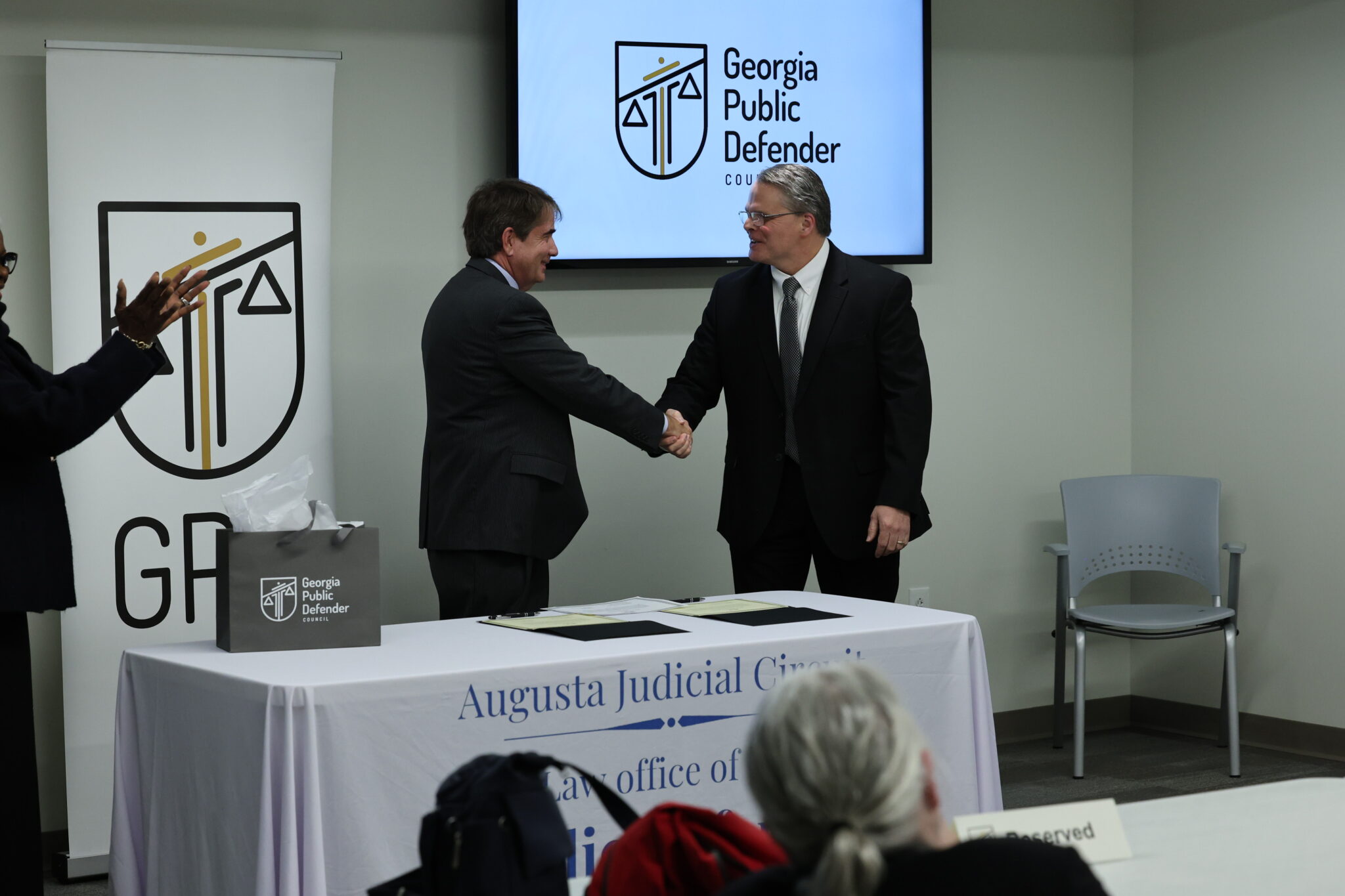 Augusta Circuit Public Defender Lee Prescott with Dublin Circuit Public Defender Clay Tapley following the administration of the oath.